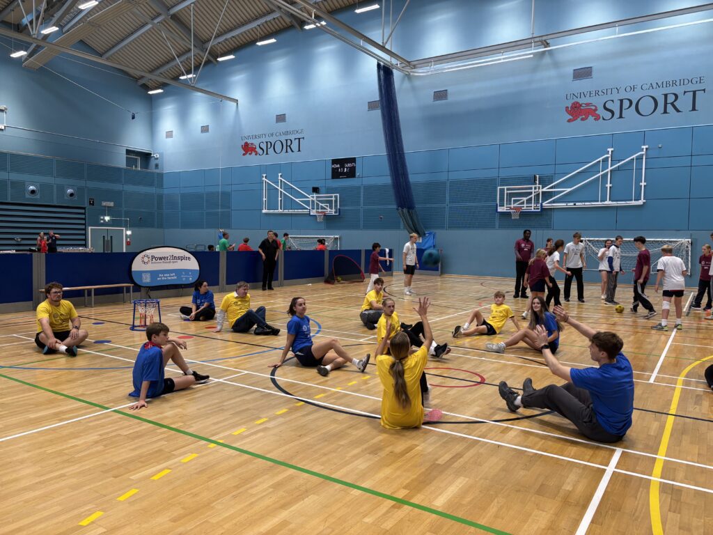 people sat playing sitting netball